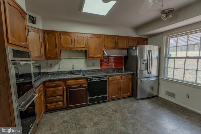 kitchen featuring extractor fan, black appliances, sink, and ceiling fan