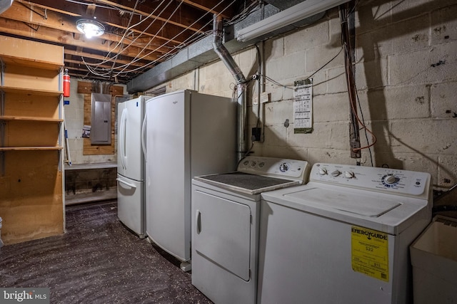 laundry area featuring separate washer and dryer, electric panel, and sink