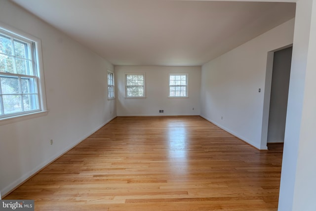 spare room with light wood-type flooring