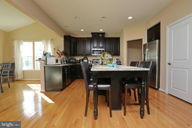 dining area with light hardwood / wood-style floors