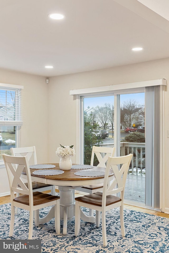 dining space featuring hardwood / wood-style floors and plenty of natural light