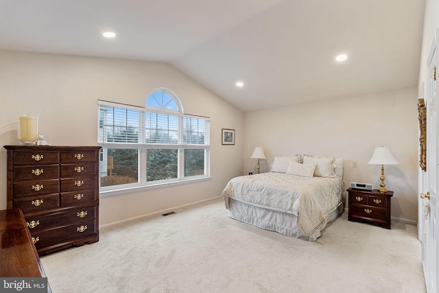 carpeted bedroom featuring vaulted ceiling