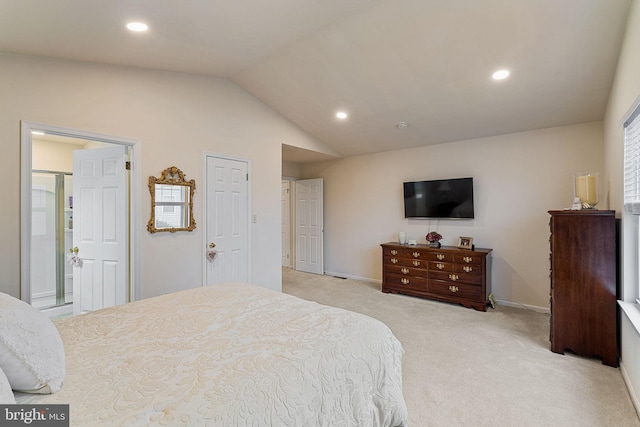 carpeted bedroom with vaulted ceiling