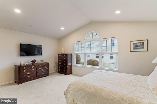 bedroom featuring vaulted ceiling and light carpet