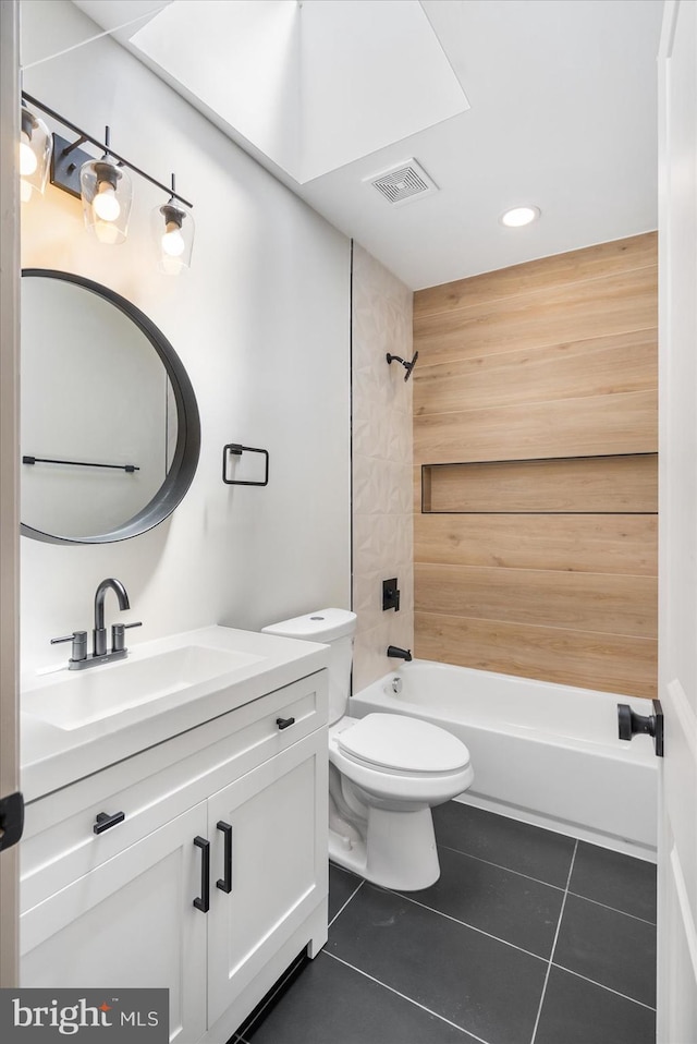 full bathroom with washtub / shower combination, vanity, toilet, and tile patterned flooring