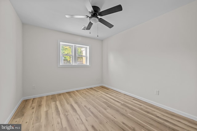 spare room with ceiling fan and light hardwood / wood-style floors