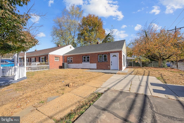 ranch-style home featuring cooling unit