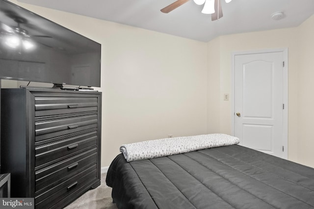 bedroom featuring ceiling fan and carpet