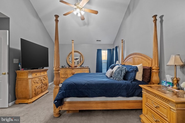 carpeted bedroom with ceiling fan and vaulted ceiling