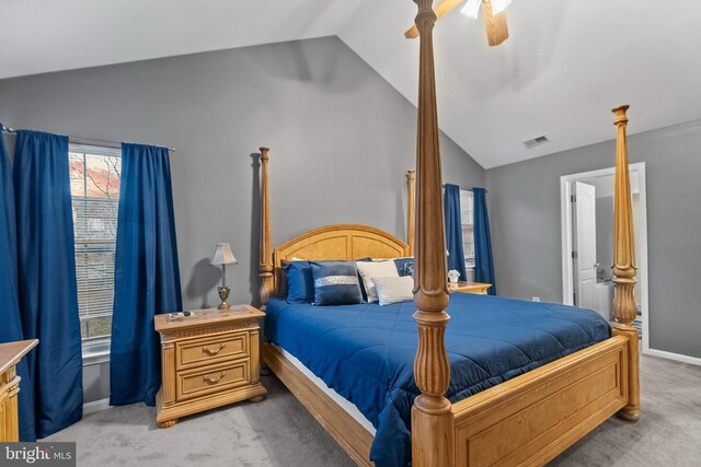 carpeted bedroom featuring ceiling fan and vaulted ceiling