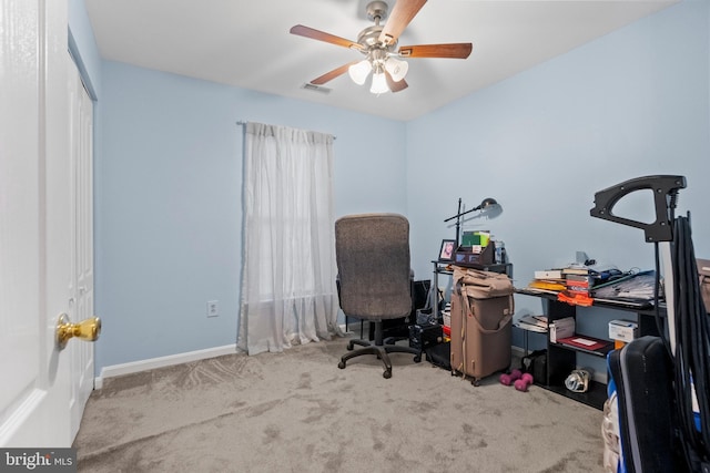 carpeted office with ceiling fan