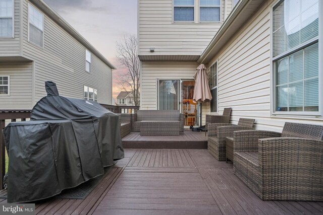 deck with area for grilling and an outdoor hangout area