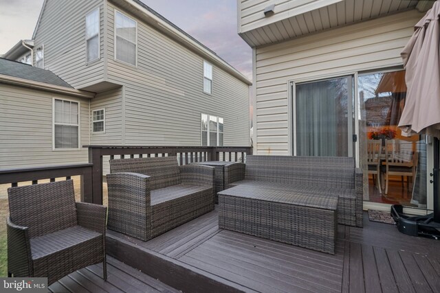 wooden terrace featuring an outdoor hangout area