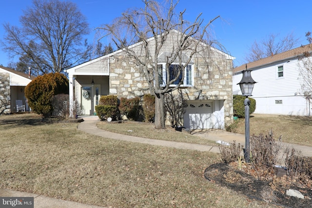 view of front of home featuring a garage and a front lawn