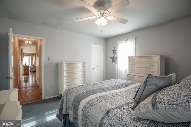 bedroom with ceiling fan and carpet flooring