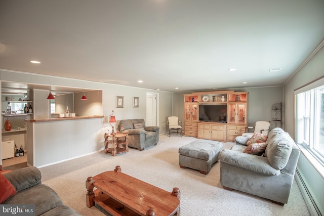 carpeted living room with ornamental molding