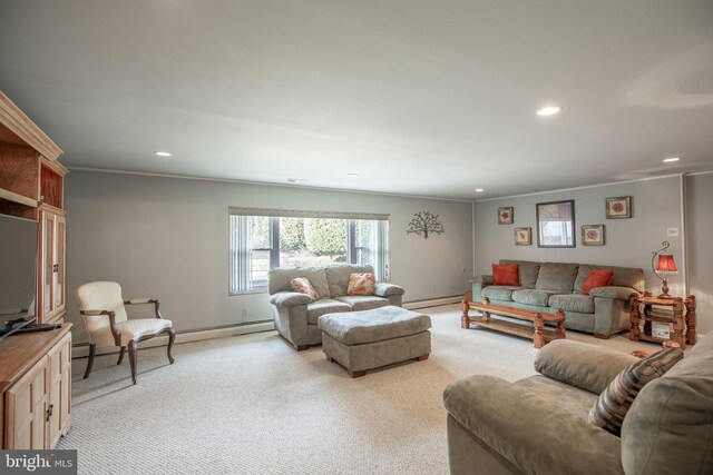 living room featuring baseboard heating, crown molding, and light carpet