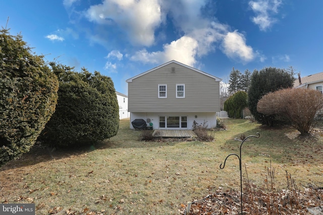 view of property exterior featuring a lawn