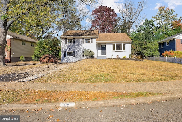 tri-level home featuring a front yard