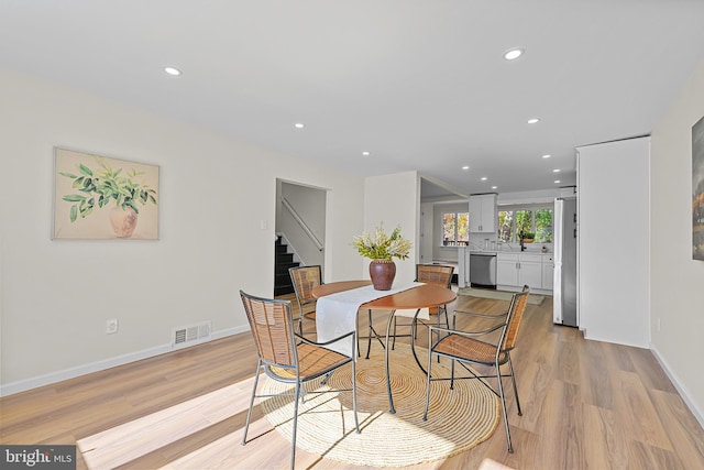 dining room featuring light hardwood / wood-style flooring