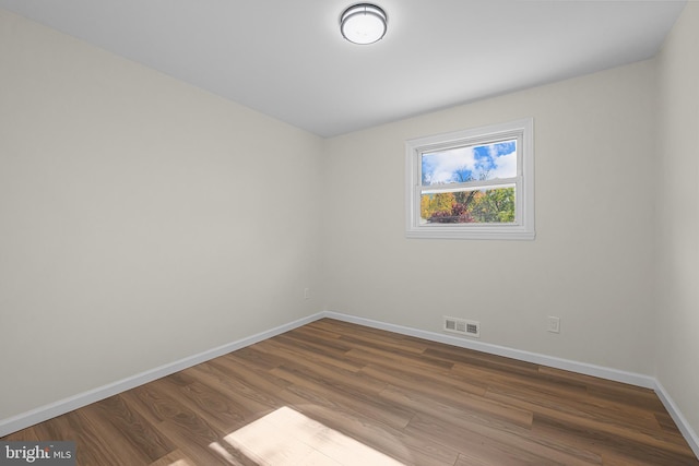 empty room featuring wood-type flooring