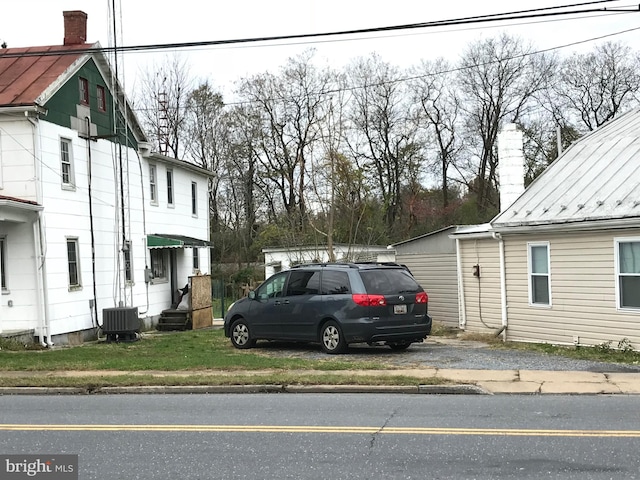 view of side of property featuring cooling unit