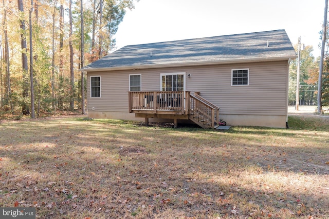 back of house with a yard and a deck