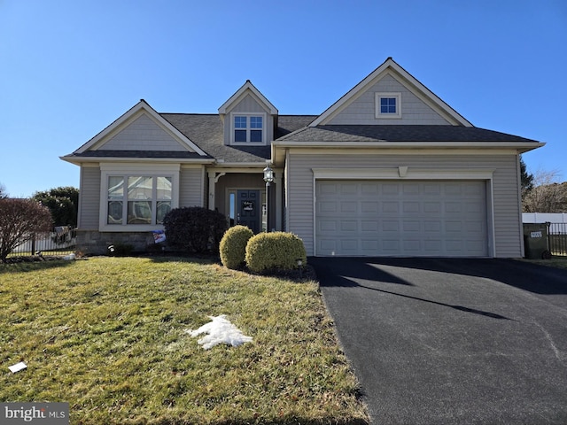 view of front facade featuring a garage and a front yard