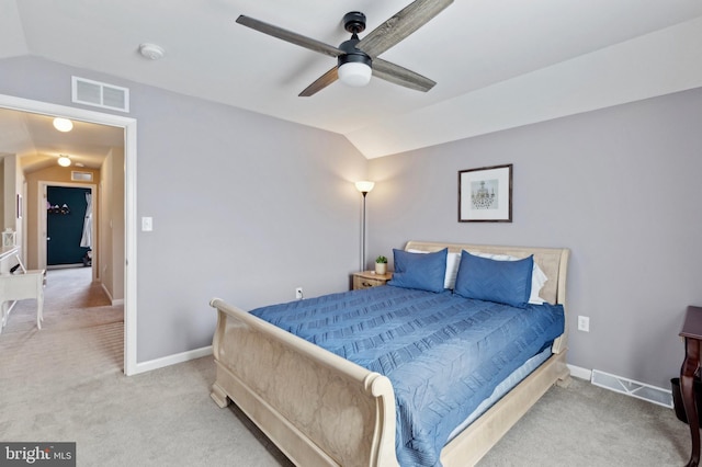 carpeted bedroom featuring lofted ceiling and ceiling fan