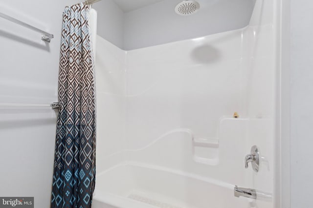 bathroom with shower / bath combination with curtain