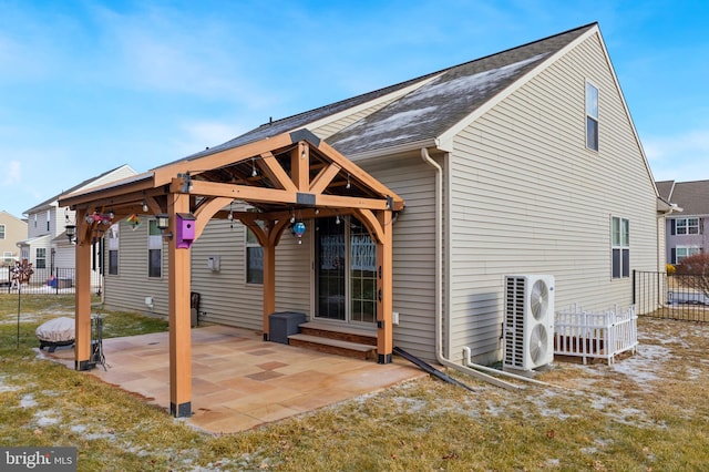 back of property with a patio area