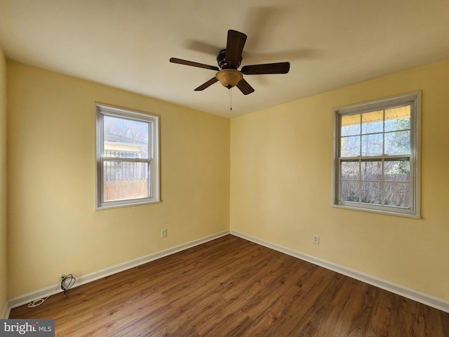 empty room featuring ceiling fan and hardwood / wood-style floors