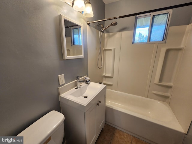 full bathroom featuring tile patterned floors, vanity, toilet, and tub / shower combination