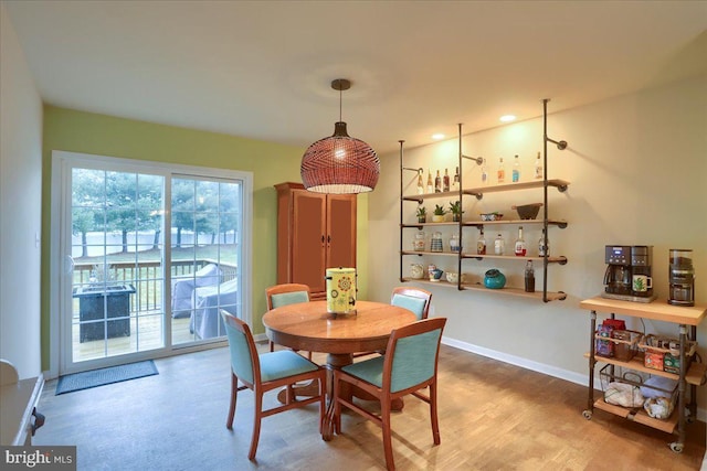 dining area with hardwood / wood-style flooring