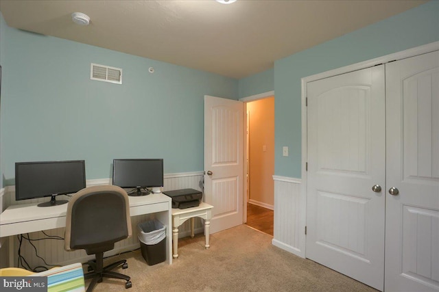 office area featuring light carpet