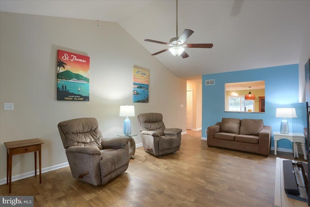 living room featuring wood-type flooring, high vaulted ceiling, and ceiling fan