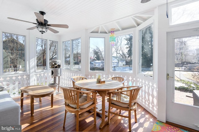 sunroom featuring ceiling fan and plenty of natural light