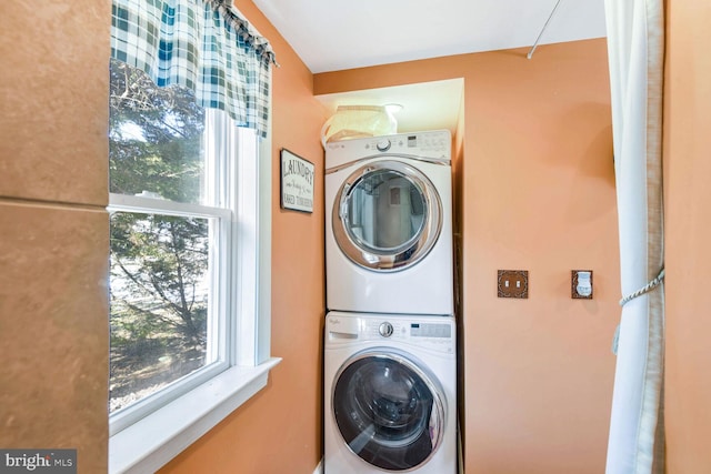 laundry room with stacked washer and clothes dryer