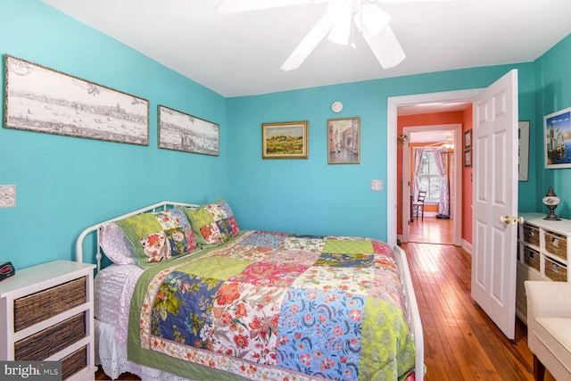 bedroom featuring hardwood / wood-style floors and ceiling fan