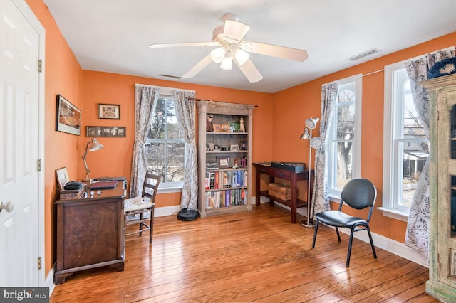 sitting room featuring ceiling fan and light wood-type flooring