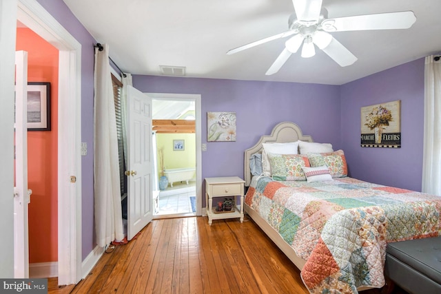 bedroom with hardwood / wood-style flooring and ceiling fan