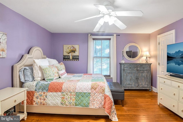 bedroom featuring hardwood / wood-style flooring and ceiling fan