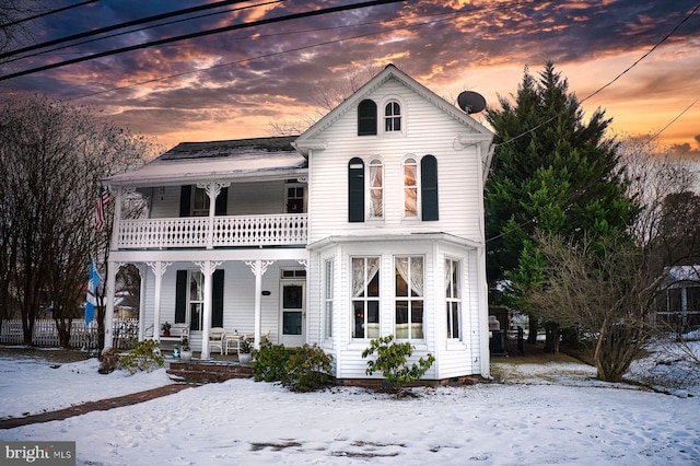 view of front of home featuring a balcony