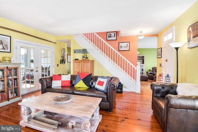 living room with hardwood / wood-style floors and french doors