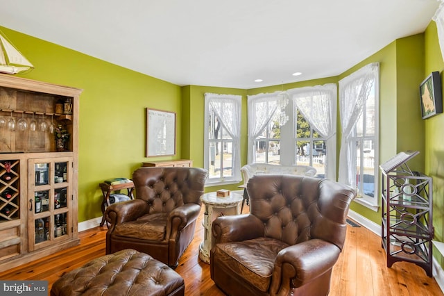 living area with hardwood / wood-style flooring