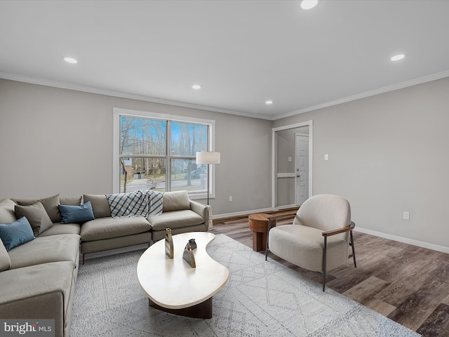 living room featuring crown molding and light wood-type flooring