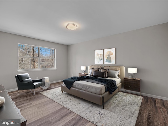 bedroom with hardwood / wood-style floors