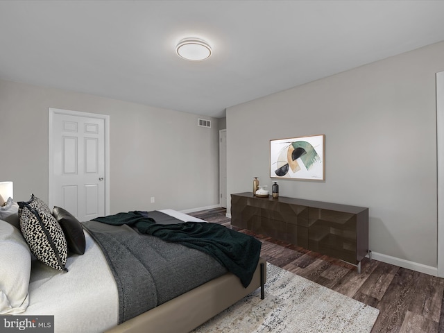 bedroom with hardwood / wood-style floors