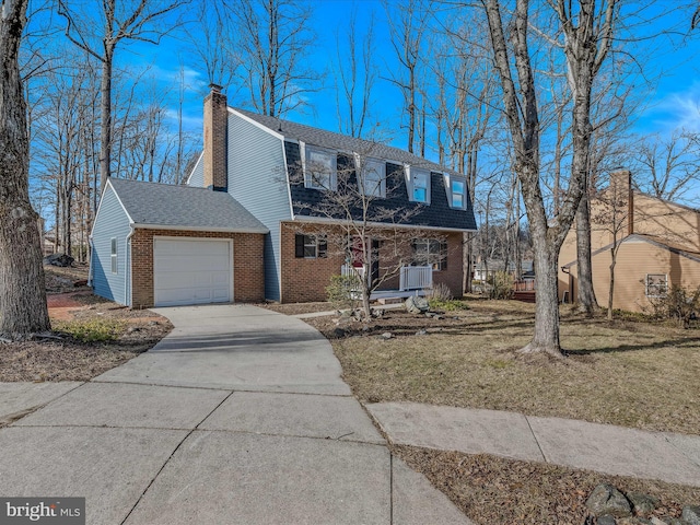 view of front of home with a garage and a front yard