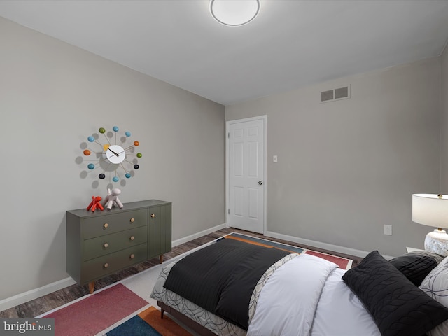 bedroom featuring dark hardwood / wood-style flooring